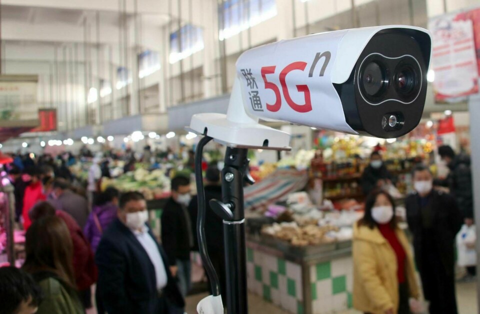 En värmekamera med 5g-teknik mäter temperaturen på besökarna på en marknad i den kinesiska staden Suzhou. Foto: ChinaImages