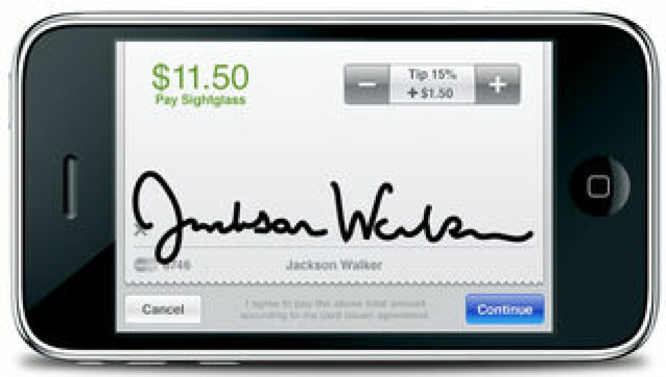 Betalningen signeras på mobilens skärm.