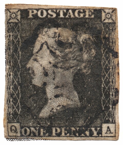 Ett svart frimärke med profilen av en kvinna