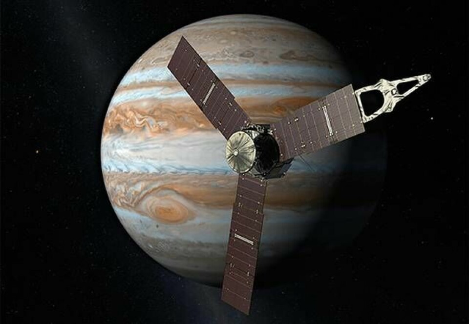 Ilustrationen visar rymdsonden Juno ovanför planeten Jupiter. Foto: NASA/JPL-Caltech via AP / TT