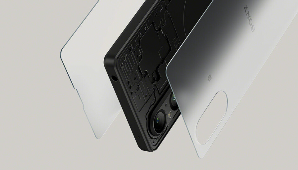 En svart smart mobiltelefon med lager av förstärkt skyddsglass på fram- och baksidan.
